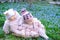 Infant girls sit basket snowdrops