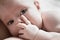 Infant lies in her mother\'s breast
