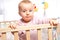 Infant in playpen