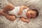 Infant sleeps in a dream emotions-newborn baby sleeping peaceful