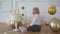 Infant, small child. Baby boy dressed in a suit - a white shirt and a bow tie.