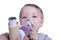 Infant using asthma inhalator