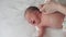 Infanty, childhood, motherhood, family, thygiene, medicine and health concept - close-up mom hands undresses bodysuit