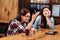 Infatuated with discussion girl holding glass with peanuts