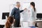 Infatuated office worker standing near board