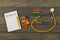 infectious epidemic concept - text Rubella, notepad, yellow stethoscope, colorful wooden jigsaw puzzles, crayons