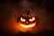 Infernal Glow Scary Halloween Jack O Lantern Face Glowing in Smoke and Fire. created with Generative AI