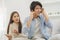 Infidelity, suspicion asian young couple love fight relationship, husband put hand on his ears, no want to hear. Wife anger