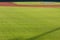 Infield Dirt And Outfield Grass Of Baseball Field