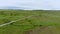 The infinite green fields in the Scottish Highlands - aerial drone flight