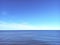 Infinite horizon with calm blue sea and clean sky