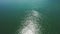 Infinite sea down view on morning sun reflection aerial drone view perfect for background. Beautiful texture of the