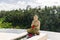 Infinity edge pool with buddha statue