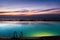 Infinity pool above seaside at dusk