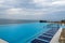 Infinity pool with crystal blue water view to sea  ocean