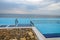 Infinity pool with crystal blue water view to sea  ocean