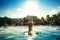 Infinity pool on luxurious exotic island. Portrait of girl wearing hat enjoying the sun at pool