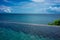 Infinity pool with plant vegetation and wide ocean view