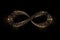 infinity sign made of shiny metallic stars on dark background