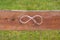 Infinity sign on a plank