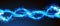 An infinity sign swirl trail with a blue magic glow on a black background. A wavy line of blue neon glitter fire sparks