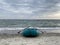 Inflatable boad on the beach on sunset