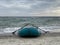 Inflatable boad on the beach on sunset