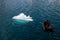 Inflatable boat with one person in Arctic waters, Svalbard. Pushing ice