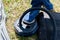 Inflatable boat pumping process, close-up. A fisherman pumps an inflatable boat with a foot pump