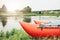 Inflatable catamaran for river rafting and fishing on grass shore