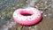 Inflatable colorful Rubber Ring floating on the seashore