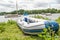 Inflatable dinghy on the bank of Wroxham Broad, Norfolk, UK