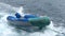 Inflatable dinghy towed after yacht in Galapagos National Park, Ecuador