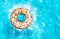 Inflatable doughnut buoy splash in a pool top view