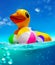 Inflatable duck swim in the water with color balls split shoot