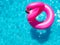 Inflatable flamingo buoy in the swim pool top view