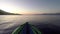 An Inflatable Kayak Gently Bobbing in Sea Bay at Dawn, Greece