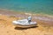 Inflatable motorboat on the sandy beach of the Mediterranean