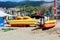 Inflatable rafts, boats and other equipment on the sand in front of the water entertainment center on the beach in Alanya