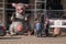 Inflatable rat is seen on the city street in front of a non-union construction site with protestors seen nearby