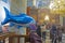 Inflatable shark in the orthodox church. Balloon for children with helium amongst praying people.