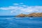 Inflatable speed boats cruising in mediterranean sea.  Lighthouse on a cape. Greece, Kea Tzia island