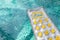 Inflatable sun lounger, swimming pool air bed mattress floating on clear water