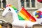 Inflatable swimming rainbow unicorn on gay pride