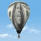 An inflated one hundred dollar bill is seen in the form of a hot air balloon
