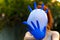 Inflated vinyl gloves.Defocused background two blue inflated vinyl gloves. Medical gloves in the hands of a girl. Coronavirus
