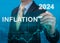 Inflation 2024. tax, cash flow and another financial concept. focused on decreasing value of money. blue background of graph of