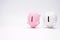 Inflation and devaluation concepts - Pink White Piggy Bank against white wall background