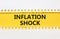 Inflation shock symbol. Concept words Inflation shock on yellow and white paper. Beautiful yellow and white background. Business