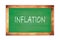 INFLATION text written on green school board